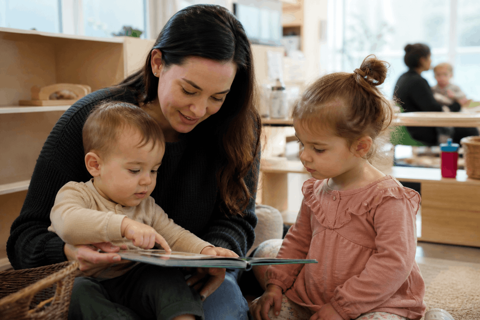 Parent with child at childcare centre